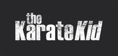 A bold, distressed logo for "The Karate Kid" movie with a gritty, textured black background and white text.